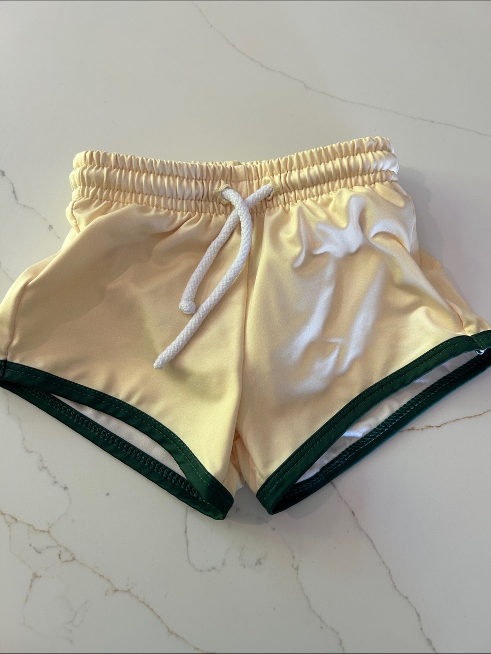 Bella Bliss boys swim trunks in butter yellow
